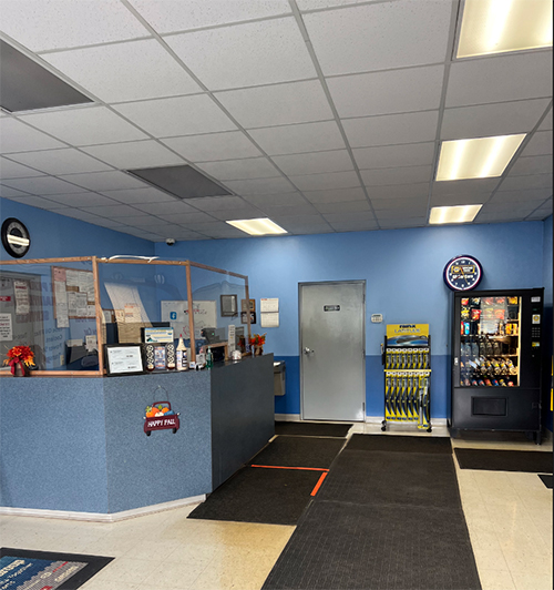 Inside shop of All Car Care. Our lobby is clean and vending machines fully stocked.